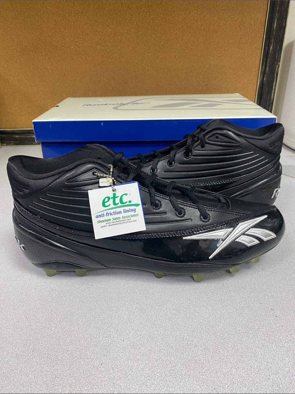 Reebok Men’s Black Athletic Cleats with Silver Logo